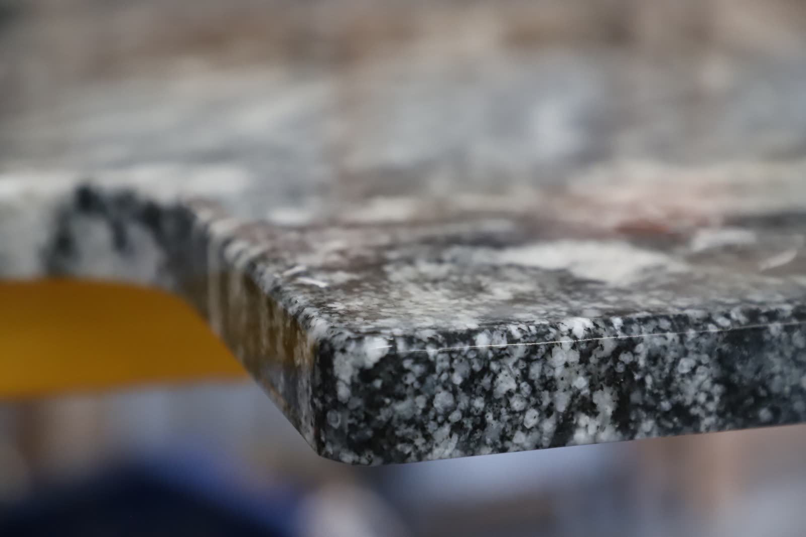 Polished edge detail on a custom stone countertop.