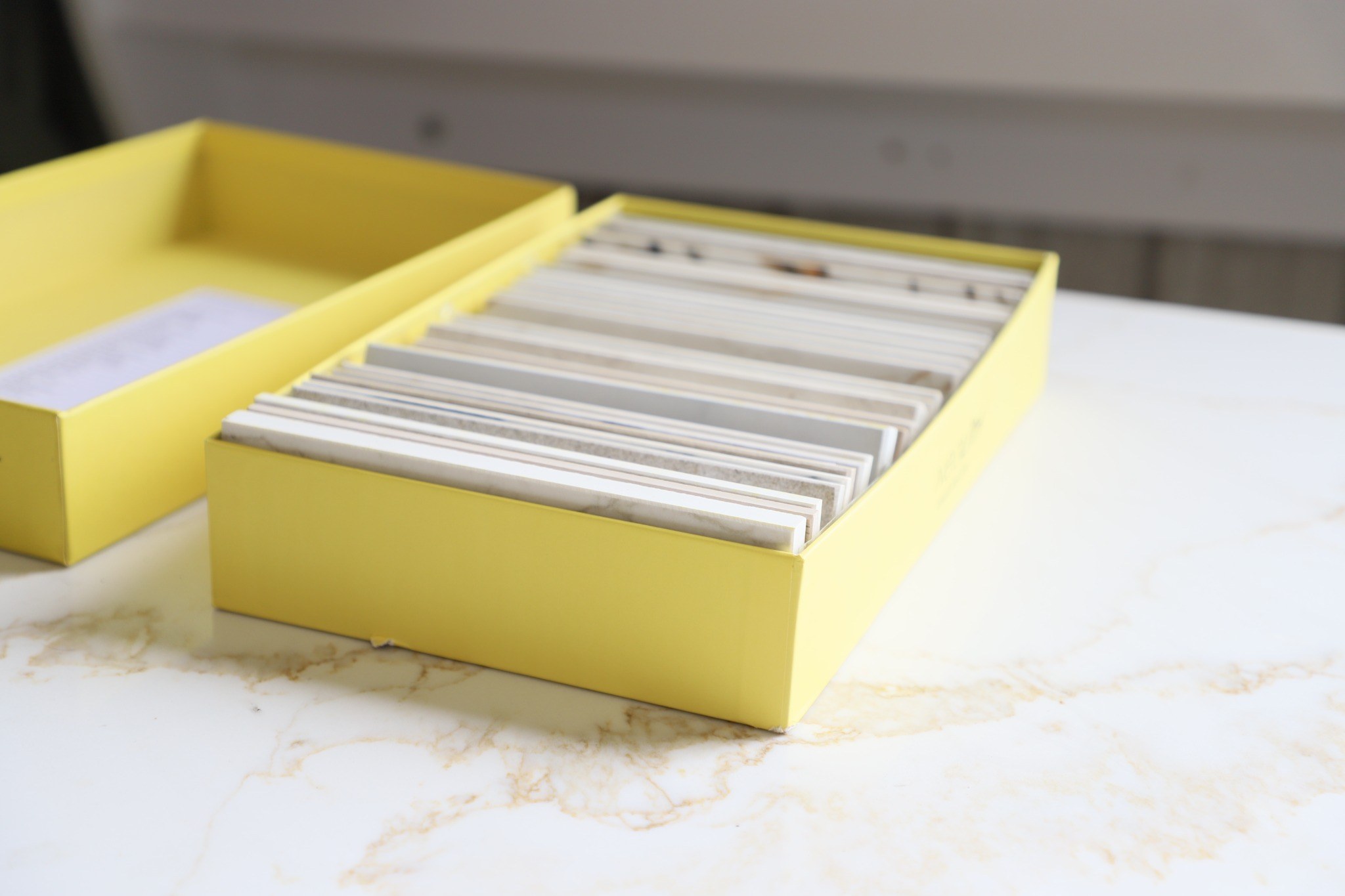 Countertop material samples arranged for customer selection.