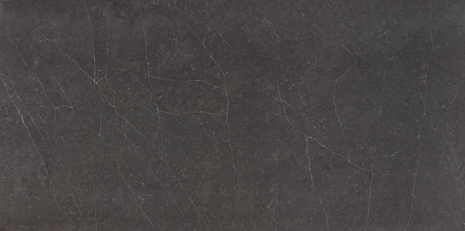 Petra Grigio — deep charcoal quartz with a dark, contemporary tone by Vadara.
