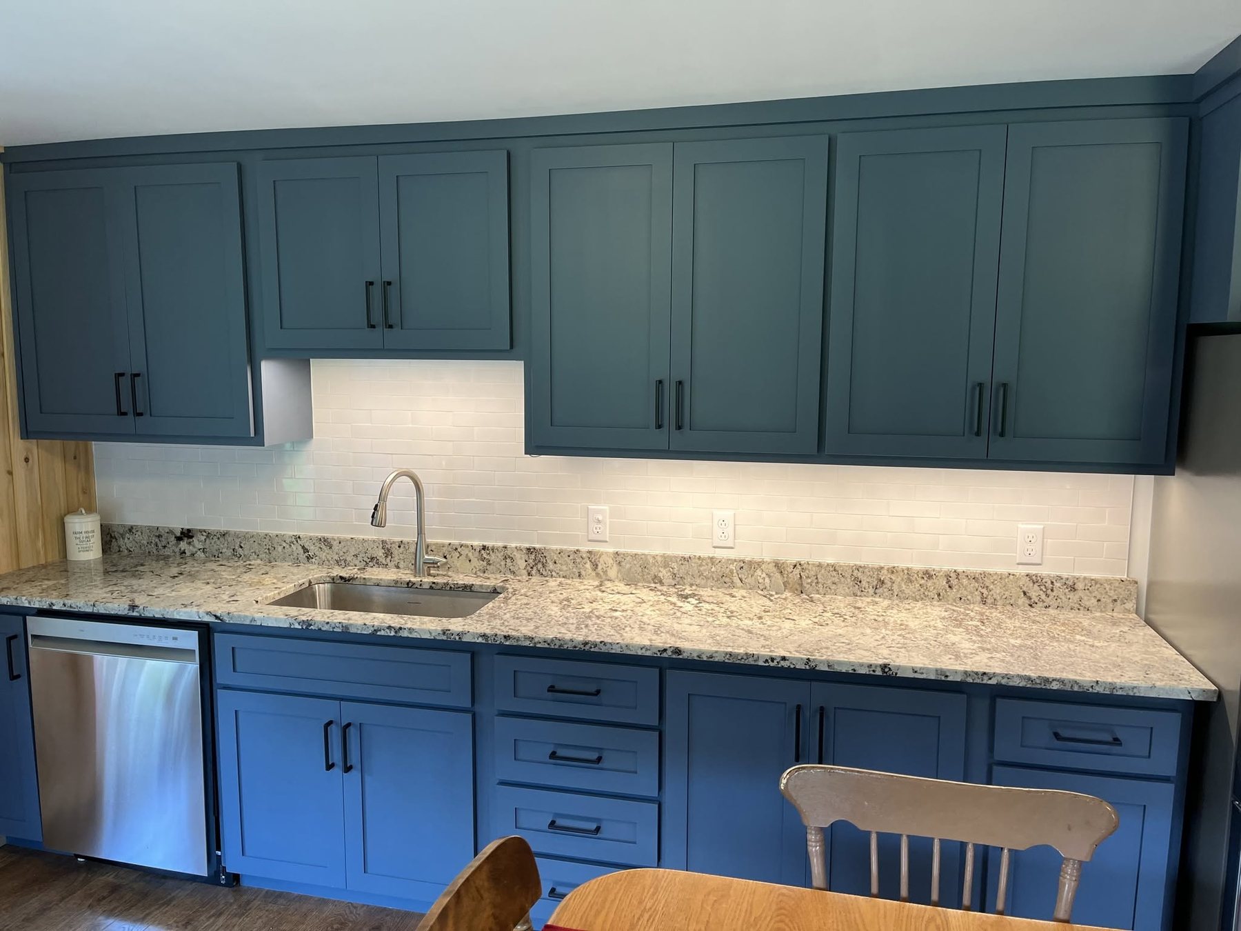 Blue Cabinet Kitchen with Patterned Stone — Oak Bay Rock & Tile