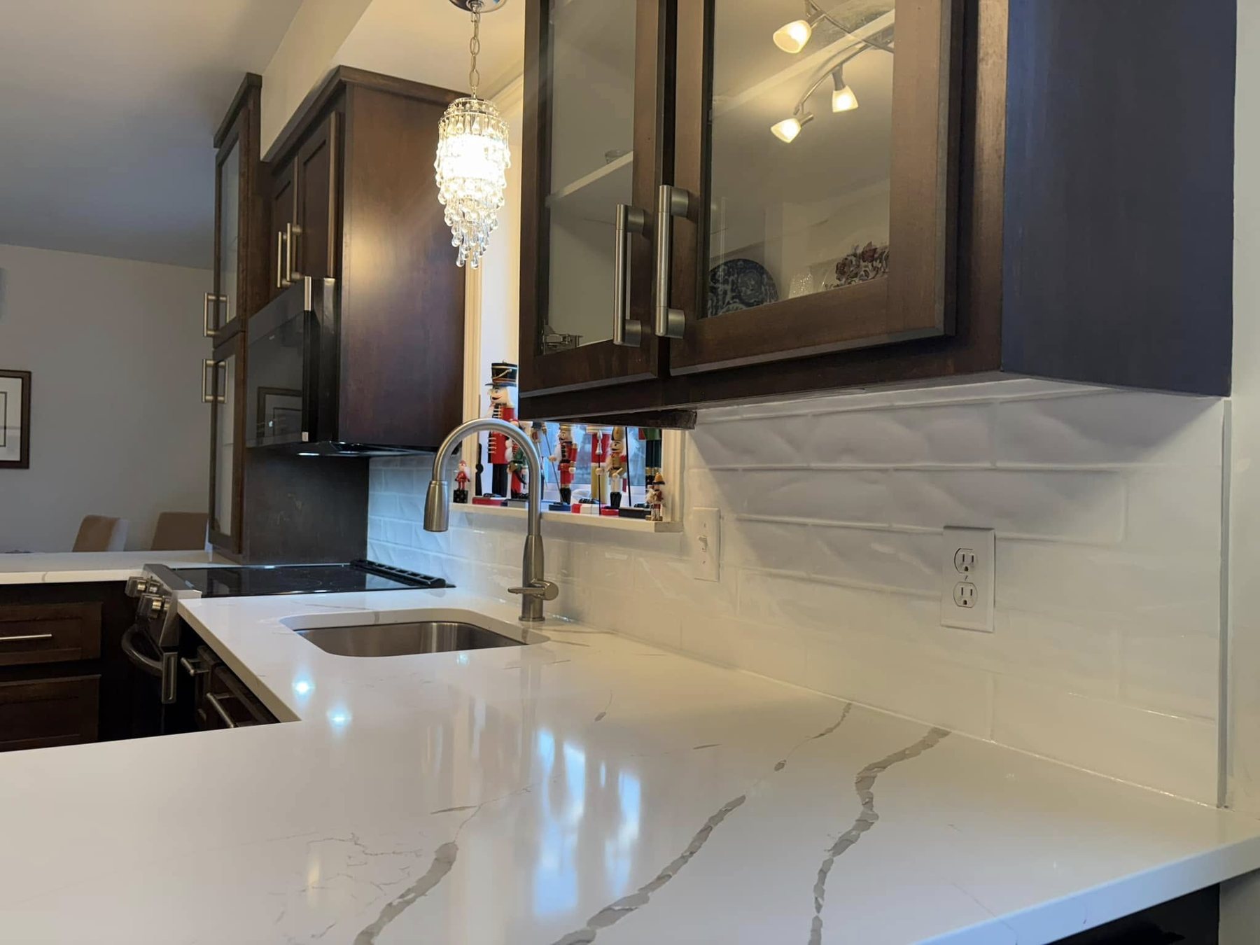 Dark cabinet kitchen — countertop and sink detail.