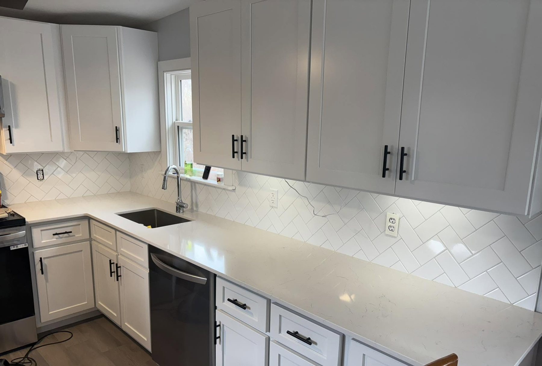 Light Countertops with White Cabinetry — Oak Bay Rock & Tile