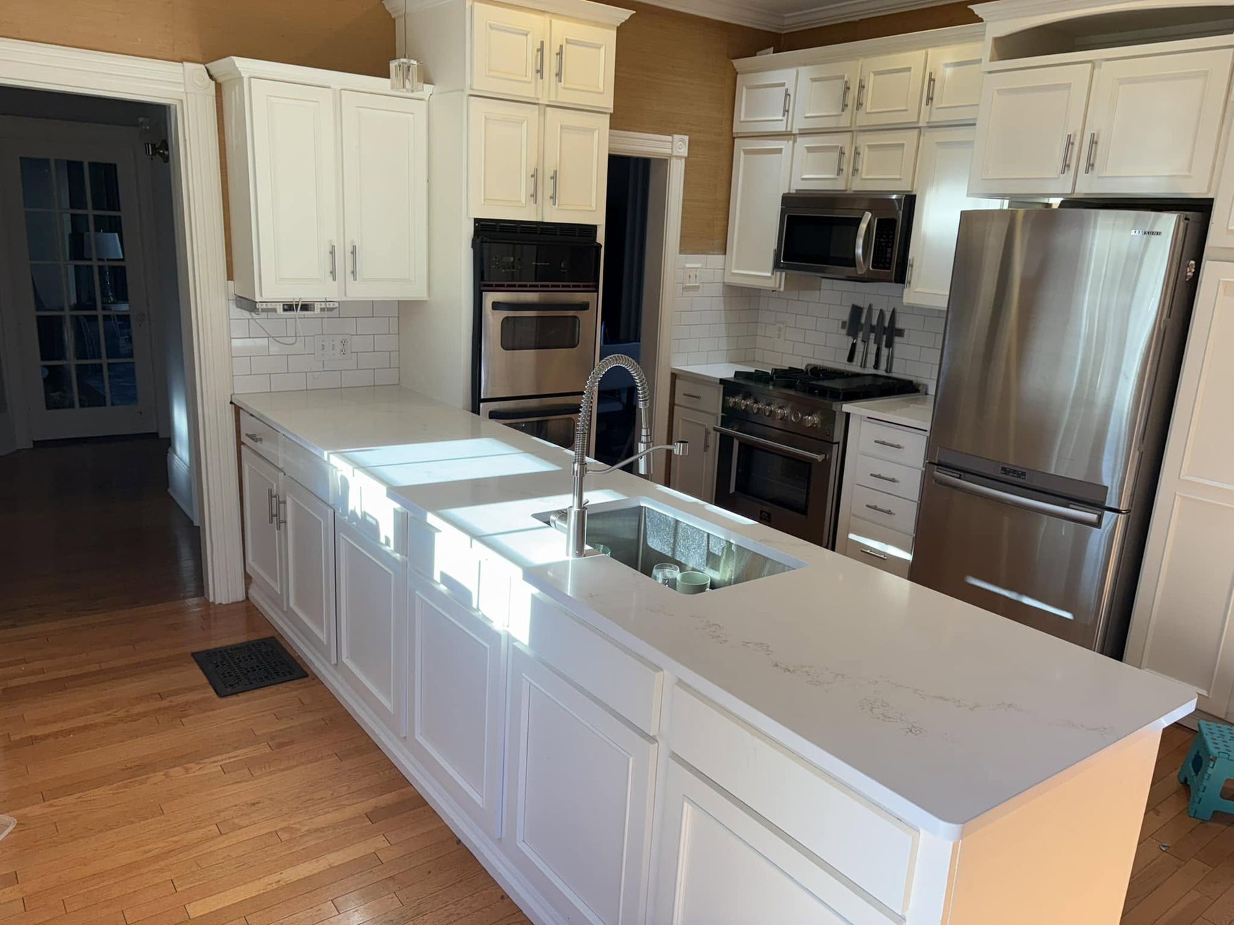 White Kitchen with Light Countertops — Oak Bay Rock & Tile
